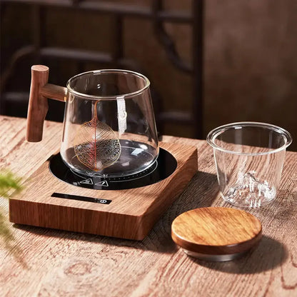 Comfort Life Cup Warmer in use on a wooden table, featuring a glass cup and wooden lid, perfect for keeping beverages warm.