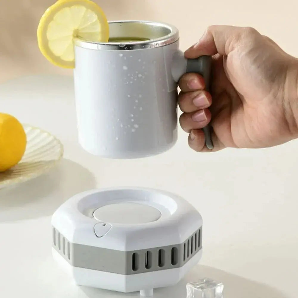 Person holding the Comfort Life Instant Cooling Cup with lemon slice, next to cooling base.